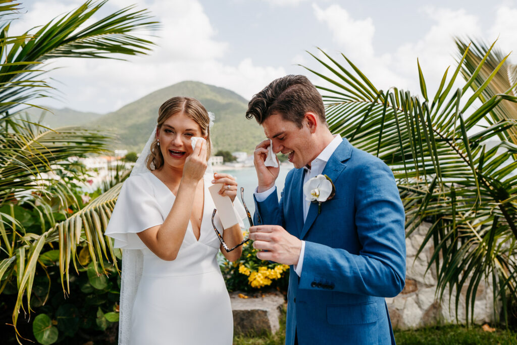 bride and groom in tears during first look at Grand Case Beach Club St. Martin