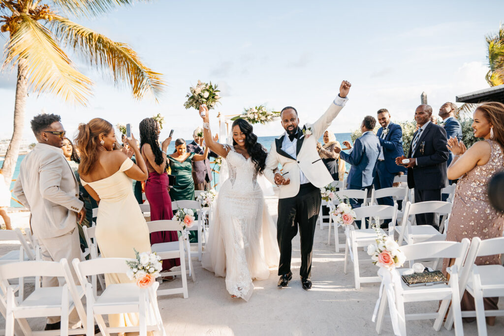 bride and groom walking down the aisle after wedding ceremony at Sonesta, St. Maarten